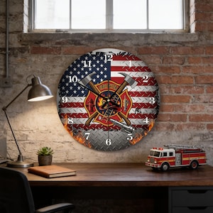 May include: A round wall clock featuring a United States flag background with a diamond plate texture. The center displays a firefighter emblem with crossed axes, a helmet, and a ladder. Black numbers mark the hours, and flames appear at the base.