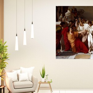 May include: A framed painting depicting a historical scene with figures in classical attire. The artwork features a central figure in a red robe, surrounded by other individuals in various poses. The color palette includes reds, browns, and whites.