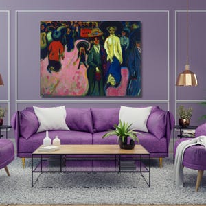 May include: An abstract painting depicting a crowd of people in various colors, including pink, red, green, and blue. The artwork hangs above a purple sofa with white pillows, a wooden coffee table, and a gray rug. The room is decorated in shades of purple.
