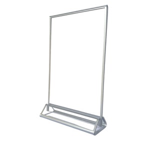 May include: Silver retractable banner stand with a triangular base. The stand is empty and ready to display a poster or sign.