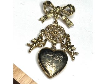 Vintage goudkleurige medaillonbrochespeld met cherubijn