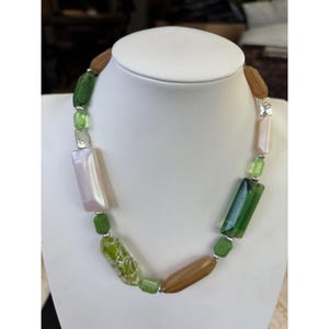 Multicolored Glass Bead Necklace With Green Brown  Pearl Tones Featuring Varied Shapes