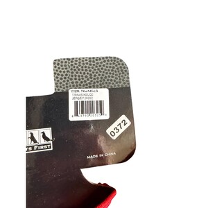 May include: A product tag with the text "ITEM: TK-4145-LG TRAVIS KELCE JERSEY (KCC)" and a barcode. The tag also features the text "TS FIRST" and "MADE IN CHINA". The tag is black and white with a red accent.