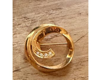 AVON Vintage Gold-Tone Swirl Brooch With Rhinestone Accents Circular Design Elegant Pin Jewelry Gift