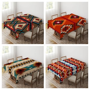 May include: Four different tablecloths featuring geometric patterns in shades of red, orange, brown, blue, and white. The tablecloths are laid on wooden tables with chairs.