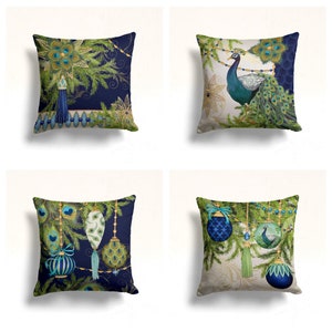 May include: Four decorative throw pillow covers with a Christmas theme. The covers feature a peacock, ornaments, and pine branches with gold accents. The background colors are blue and white.