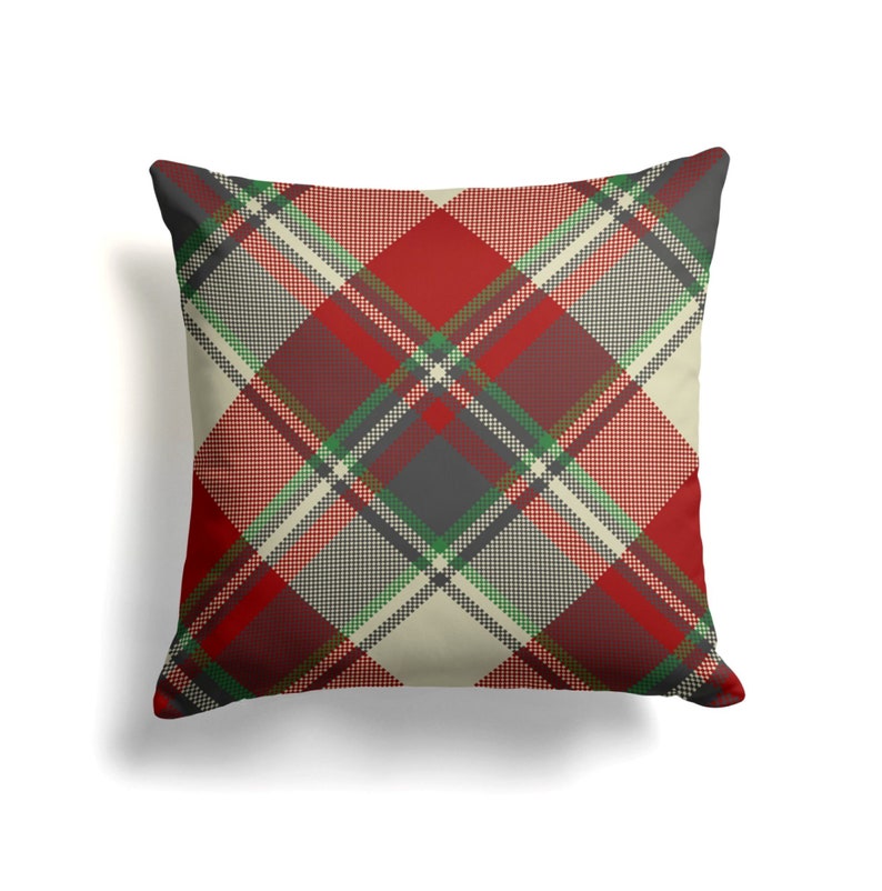May include: Red, green, and gray plaid throw pillow with a cream background.