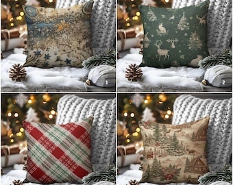 May include: Four decorative cushions with festive designs. The cushions display various patterns, including a celestial design, a forest scene with deer, a red and green plaid, and a winter landscape with cabins and trees. The cushions are displayed on a white surface.