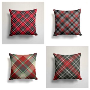 May include: Four square throw pillows with a red, black, and white plaid pattern. The pillows are arranged in a grid pattern.