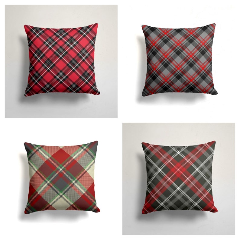 May include: Four square throw pillows with a red, black, and white plaid pattern. The pillows are arranged in a grid pattern.