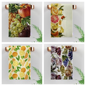 May include: Four different kitchen towel designs. The first towel features a colorful fruit design with a pineapple, grapes, and a peach. The second towel features a citrus design with lemons, oranges, and limes. The third towel features a citrus design with lemons, oranges, and limes. The fourth towel features a floral design with roses and grapes.