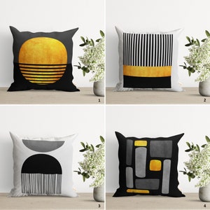 May include: Four different throw pillow designs with geometric patterns in black, white, and gold. The pillows are on a white surface with a plant in a pot in the background.