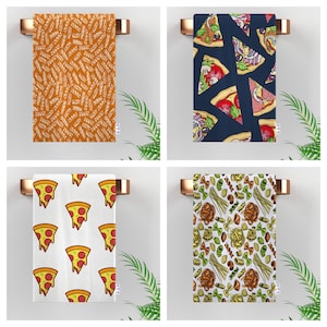 May include: Four kitchen towels with different designs. The first towel has a white and orange pattern. The second towel has a blue background with a pizza slice pattern. The third towel has a white background with a pizza slice pattern. The fourth towel has a white background with a pasta and noodle pattern.