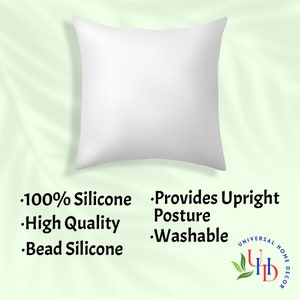May include: White pillow with a white background. The pillow is made of 100% silicone and is filled with bead silicone. It provides upright posture and is washable. The pillow is labeled with the text "Universal Home Decor".