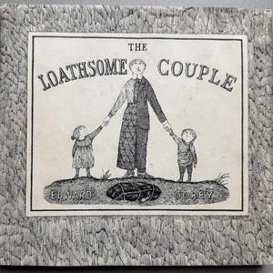 May include: A black and white illustration of a book cover titled "The Loathsome Couple" by Edward Gorey. The cover features a couple and a child, all with unusual features.
