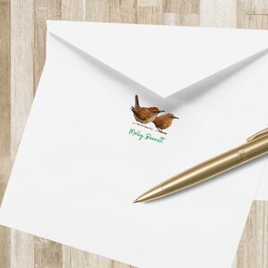 May include: White envelope with a green handwritten name "Molly Bennett" and a small image of two brown birds.