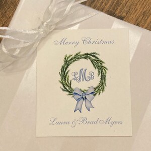 Christmas gift tag with monogram, green wreath, blue bow. Customize with your initials and text of your choice. Merry Christmas or Happy Holidays on top of card with your name at bottom of card. Use for elegant gift tags for the holidays