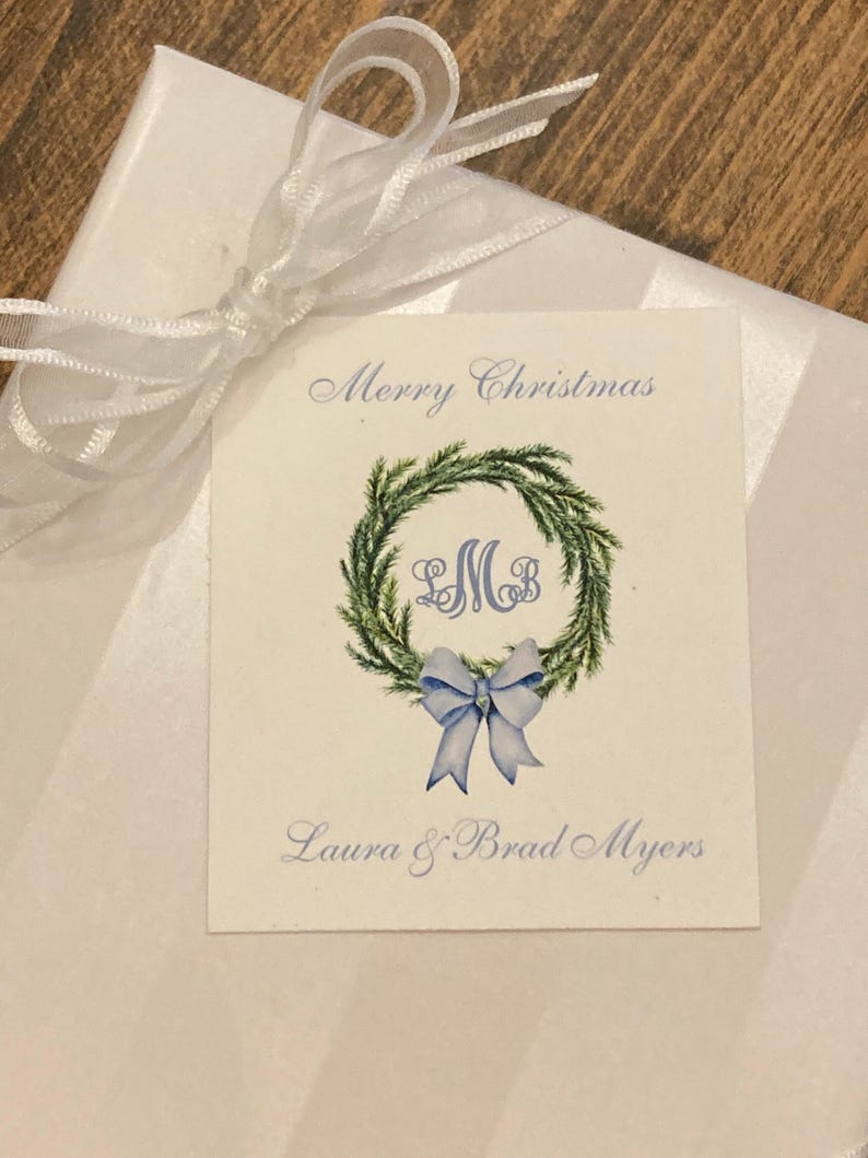 Christmas gift tag with monogram, green wreath, blue bow. Customize with your initials and text of your choice. Merry Christmas or Happy Holidays on top of card with your name at bottom of card. Use for elegant gift tags for the holidays