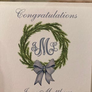 Christmas gift tag with monogram, green wreath, blue bow. Customize with your initials and text of your choice. Merry Christmas or Happy Holidays on top of card with your name at bottom of card. Use for elegant gift tags for the holidays