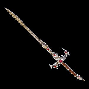 May include: A silver sword with a decorative, ornate handle. The handle is adorned with red gemstones and intricate designs. The blade is long and sharp.
