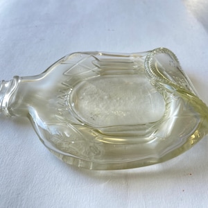 Melted Crown Royal bottle candle holder, catch all, serving tray, coaster, spoon rest, unique upcycled bar decor gift