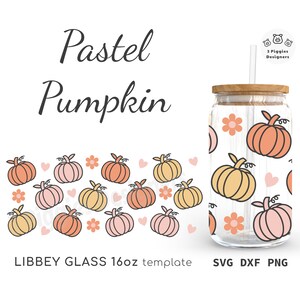 May include: A 16oz clear glass tumbler with a wooden lid and straw. The tumbler is decorated with a pattern of pastel pink, orange, and yellow pumpkins and white flowers. The text "Pastel Pumpkin" is at the top of the image and "LIBBEY GLASS 16oz template SVG DXF PNG" is at the bottom.