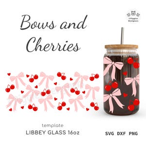 May include: A clear glass Libbey 16oz tumbler with a wooden lid and a silver straw. The tumbler is decorated with pink bows, red cherries, and small red hearts. The words "Bows and Cherries" are written in black script.