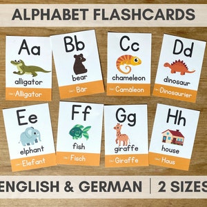 May include: Alphabet flashcards with illustrations of animals and objects. Each card features a letter, the English word, and the German word. The letters are A through H.