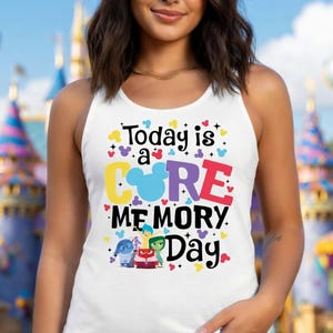 May include: White tank top with the text "Today is a Core Memory Day" in colorful letters. The design includes a Mickey Mouse head and cartoon characters. The tank top is sleeveless.