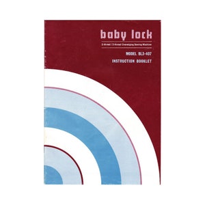 May include: A red instruction booklet for a Baby Lock BL3-407 2-thread/3-thread overedging sewing machine. The cover features a white, blue, and pink circular design.