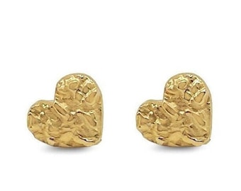 May include: A pair of gold heart-shaped stud earrings. The earrings have a textured, hammered finish.