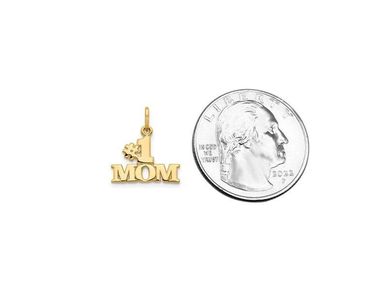 May include: Gold-tone pendant charm with the words "#1 MOM" in a bold font. The charm is about the size of a US quarter.