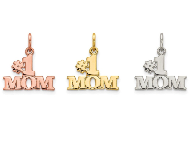 May include: Three gold charms with the words "#1 MOM" in different colors: rose gold, yellow gold, and silver.