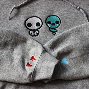 Moletom com capuz inspirado em The Forgotten Binding of Isaac