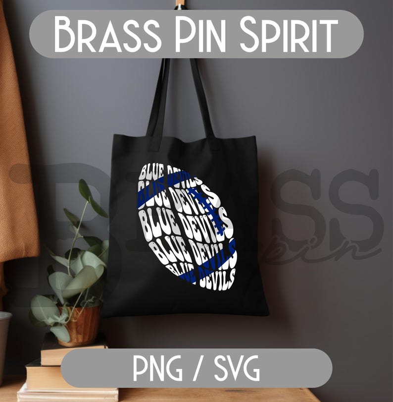 May include: Black tote bag with a white and blue football graphic. The graphic features the words "BLUE DEVILS" in a repeating pattern. The text "BRASS PIN SPIRIT" is at the top, and "PNG / SVG" is at the bottom.