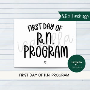May include: A white sign with the text "FIRST DAY OF R.N. PROGRAM" in black, with a small heart symbol. The sign is 8.5 x 11 inches. A green circle with the text "isabella ro PRINTABLES" is in the bottom right corner.