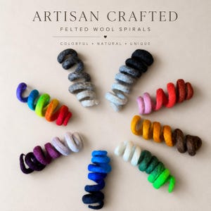 May include: Artisan crafted felted wool spirals in various colors, including rainbow, blue, and brown. The text reads "Colorful, Natural, Unique". The spirals are arranged on a neutral background.