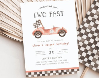 May include: A red race car with a checkered flag on top, a number 2 on the side, and the text "GROWING UP. TWO FAST" at the top of the invitation. The invitation is for Oliver's second birthday party on December 20th at 12 PM. The invitation includes the address and RSVP information.