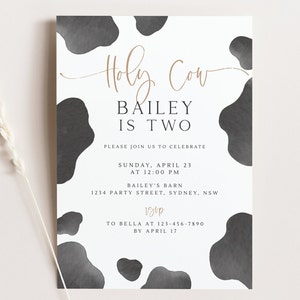 May include: A white invitation with a black and white cow print background. The text "Holy Cow Bailey is Two" is written in gold script. The invitation details a birthday party on Sunday, 23rd April at 12:00 PM at Bailey's Barn, 1234 Party Street, Sydney, NSW. RSVP by 17th April to Bella at 123-456-7890.