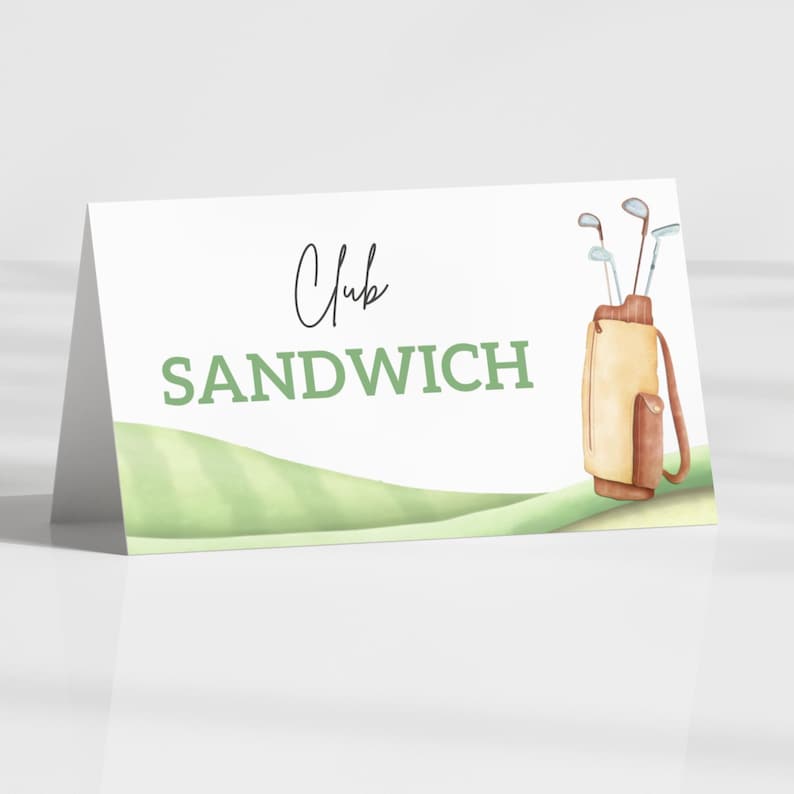 May include: A white, folded card featuring the words "Club SANDWICH" in green and black script. A watercolour illustration of a golf bag with clubs is on the right. A green golf course design is at the bottom.