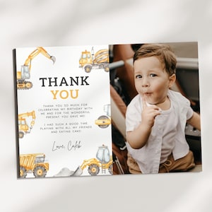 May include: A personalized birthday thank you card featuring a watercolor illustration of construction vehicles in yellow and gray. The card includes the text "THANK YOU" and a message of gratitude, along with a photo of a young child.
