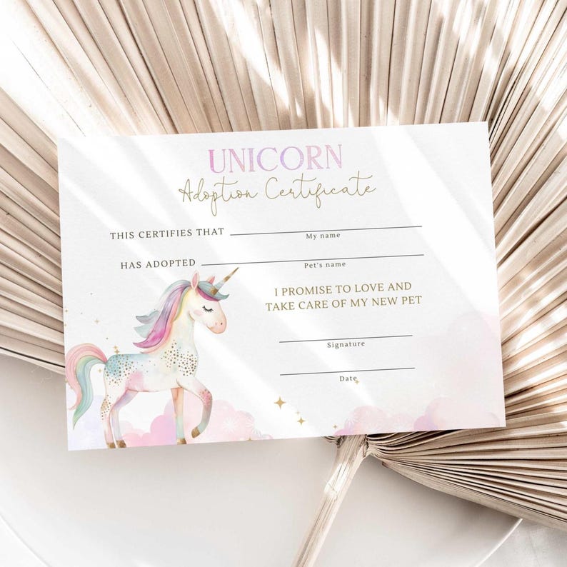 May include: A pastel-colored unicorn adoption certificate. The certificate features a watercolor illustration of a unicorn with a rainbow mane and tail. The text reads "UNICORN Adoption Certificate" and includes spaces for the adopter's and pet's names.