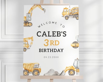 Op de afbeelding: Een wit welkomsbord met gele bouwvoertuigen. Het bord zegt "Welkom bij Caleb's 3rd Birthday 04.23.20XX".