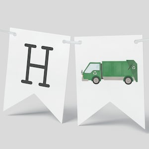 May include: A green garbage truck with a recycling symbol on the side. The truck is on a white banner with the letter "H" on the left side.
