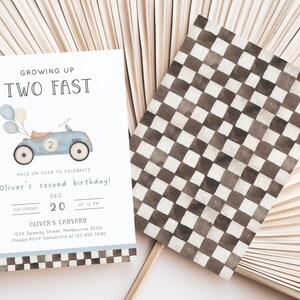 May include: A blue and white birthday invitation with a cartoon car and balloons. The text reads "Growing Up Two Fast" and "Oliver's second birthday!" with the date and time of the party. The invitation also includes the address and RSVP information.