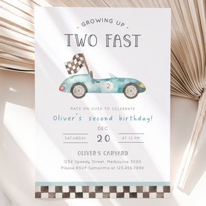 May include: A blue and white race car birthday invitation with a checkered flag. The invitation says "Growing Up Two Fast" and "Oliver's second birthday!" with the date and time of the party. The invitation also includes the address and RSVP information.
