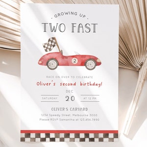 May include: A red race car with a checkered flag on top, with the number "2" on the side. The invitation says "Growing Up Two Fast" and is for Oliver's second birthday party on December 20th at 12 PM. The invitation includes the address and RSVP information.