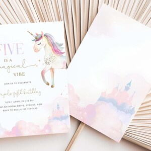 May include: A set of two invitation cards. The front card features a unicorn illustration with the text "FIVE is a magical VIBE" and event details. The back card has a castle design. Soft pastel colors are used.