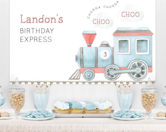 May include: A birthday party banner with a watercolor train illustration. The banner reads "Landon's BIRTHDAY EXPRESS" in red text. The train is blue and red, with the number 3 on the side. The words "CHUGGA CHUGGA CHOO" are also on the banner.