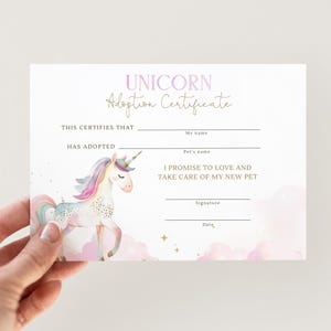 May include: A pastel-colored unicorn adoption certificate. The certificate features a watercolor illustration of a unicorn with a rainbow mane and tail. Text includes "Unicorn Adoption Certificate", lines for names, and a promise to love and care for a new pet.